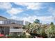 Scenic view with community pool and lush vegetation, set against a vibrant skyline backdrop at 794 Oakmont Ave # 106, Las Vegas, NV 89109