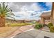 Expansive backyard featuring mature trees, lush lawn, and a glimpse of a charming camper at 8216 Tursi Lodge Ct, Las Vegas, NV 89131