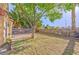 Backyard features a brick perimeter and a grass area at 8231 Burnt Sienna St, Las Vegas, NV 89123