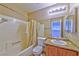 Full bathroom featuring a shower-tub combo, granite counters, and modern fixtures at 8231 Burnt Sienna St, Las Vegas, NV 89123