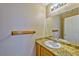 Stylish half bath featuring granite counters, sink and a decorative towel rack at 8231 Burnt Sienna St, Las Vegas, NV 89123