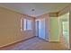 Cozy bedroom with neutral walls, closet, carpeted flooring, and natural light at 8231 Burnt Sienna St, Las Vegas, NV 89123