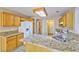 Spacious kitchen featuring granite countertops, refrigerator and ample storage space at 8231 Burnt Sienna St, Las Vegas, NV 89123