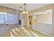 Open concept living area featuring a cozy fireplace, tile floors and staircase at 8231 Burnt Sienna St, Las Vegas, NV 89123