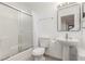 Bathroom with shower and tub combination, pedestal sink and tile flooring at 848 Hedge Way # 5, Las Vegas, NV 89110
