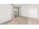 Bedroom with neutral carpet and large sliding door to exterior patio at 848 Hedge Way # 5, Las Vegas, NV 89110