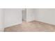Bedroom features neutral carpet, white walls, and entry to the bathroom at 848 Hedge Way # 5, Las Vegas, NV 89110