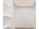 Walk-in closet features white walls and shelving at 848 Hedge Way # 5, Las Vegas, NV 89110
