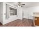 Cozy dining area with wood-look flooring, bright lighting, and access to the laundry area at 848 Hedge Way # 5, Las Vegas, NV 89110