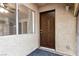 Inviting entryway featuring a solid front door, sidelight window, and neutral tones at 848 Hedge Way # 5, Las Vegas, NV 89110