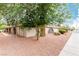 Charming single-story home featuring arched entryways, desert landscaping, and mature shade trees at 848 Hedge Way # 5, Las Vegas, NV 89110