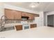 Well-maintained kitchen with white appliances, wood cabinets, and ample counter space at 848 Hedge Way # 5, Las Vegas, NV 89110