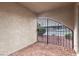 Exterior patio with rock bed and metal decorative security gate at 848 Hedge Way # 5, Las Vegas, NV 89110