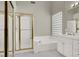 Bathroom with a shower, tub, glass block window, and white cabinets at 8612 Chiquita Dr, Las Vegas, NV 89128