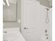 Bright bathroom featuring a white vanity and a shower with white tile surround at 8612 Chiquita Dr, Las Vegas, NV 89128
