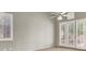 Bright bedroom featuring a ceiling fan, french doors, and neutral decor at 8612 Chiquita Dr, Las Vegas, NV 89128
