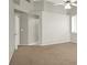 Empty bedroom featuring neutral colored walls, carpeting, and a ceiling fan at 8612 Chiquita Dr, Las Vegas, NV 89128