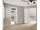 Bright bedroom with ceiling fan and multiple doorways at 8612 Chiquita Dr, Las Vegas, NV 89128