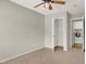 Empty bedroom featuring neutral colored walls, carpeting, and an open closet at 8612 Chiquita Dr, Las Vegas, NV 89128