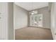 Empty bedroom featuring neutral colored walls, carpeting, french doors, and a ceiling fan at 8612 Chiquita Dr, Las Vegas, NV 89128