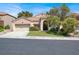 Charming single-story home featuring a well-manicured lawn, two-car garage and a welcoming entrance at 8612 Chiquita Dr, Las Vegas, NV 89128