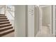 Hallway with carpeted stairs and access to a bathroom at 8612 Chiquita Dr, Las Vegas, NV 89128