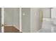 Hallway view leading to a bathroom featuring a tub and a glass block window at 8612 Chiquita Dr, Las Vegas, NV 89128