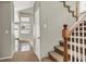 Hallway with carpeted stairs leading to upper level, connecting various living spaces at 8612 Chiquita Dr, Las Vegas, NV 89128