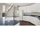 Bright kitchen boasts white cabinetry, modern appliances, and sleek countertops at 8612 Chiquita Dr, Las Vegas, NV 89128