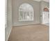 Spacious living room features large windows with white shutters, and neutral decor throughout at 8612 Chiquita Dr, Las Vegas, NV 89128