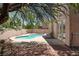 Inviting backyard pool surrounded by desert landscaping, a perfect outdoor relaxation space at 8612 Chiquita Dr, Las Vegas, NV 89128