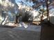 Backyard features mature landscaping, a patio, a privacy wall, and desert landscaping at 9709 Port Orange Ln, Las Vegas, NV 89134