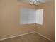 Bedroom with neutral-colored walls, carpet, ceiling fan and window with blinds at 9709 Port Orange Ln, Las Vegas, NV 89134