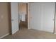 Bedroom with white closet doors and neutral colored carpet at 9709 Port Orange Ln, Las Vegas, NV 89134