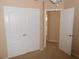 Bedroom features closet with doors and door to bathroom at 9709 Port Orange Ln, Las Vegas, NV 89134