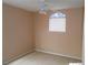 Bedroom featuring neutral walls, carpet, ceiling fan, and window with decorative glass at 9709 Port Orange Ln, Las Vegas, NV 89134