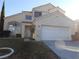 Charming two-story home boasts a well-manicured lawn and attached two-car garage at 9709 Port Orange Ln, Las Vegas, NV 89134