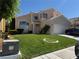 Charming two-story home with a well-manicured lawn and attached two car garage at 9709 Port Orange Ln, Las Vegas, NV 89134
