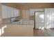 Bright kitchen with white cabinetry, modern appliances, and tiled flooring at 9709 Port Orange Ln, Las Vegas, NV 89134
