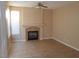 Cozy living room featuring a decorative fireplace and tile flooring at 9709 Port Orange Ln, Las Vegas, NV 89134