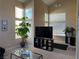 Bright living room with large windows, neutral carpet and modern decor at 9709 Port Orange Ln, Las Vegas, NV 89134