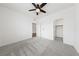 Spacious bedroom featuring a ceiling fan and walk-in closet for storage at 9839 Berkley Brook Ct, Las Vegas, NV 89141