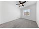 Bedroom with neutral carpet, a ceiling fan, and a window with natural light at 9839 Berkley Brook Ct, Las Vegas, NV 89141