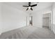 A light and bright bedroom features a walk-in closet and neutral carpet at 9839 Berkley Brook Ct, Las Vegas, NV 89141