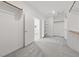A walk-in closet with carpet, shelving and clothes bars leading to the primary bathroom at 9839 Berkley Brook Ct, Las Vegas, NV 89141