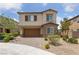 Charming two-story home featuring a two-car garage and a beautifully landscaped front yard at 9839 Berkley Brook Ct, Las Vegas, NV 89141