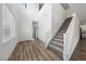 Bright foyer featuring soaring ceilings, wood-look floors, staircase, and a welcoming atmosphere at 9839 Berkley Brook Ct, Las Vegas, NV 89141