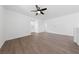 A spacious living room featuring hard surface floors and a ceiling fan at 9839 Berkley Brook Ct, Las Vegas, NV 89141