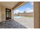 Inviting covered patio featuring a backyard pool, perfect for relaxation and outdoor entertaining at 9839 Berkley Brook Ct, Las Vegas, NV 89141