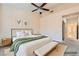 Comfortable bedroom featuring a queen bed, neutral decor, and ample natural light, creating a relaxing retreat at 9920 Netherton Dr, Las Vegas, NV 89134